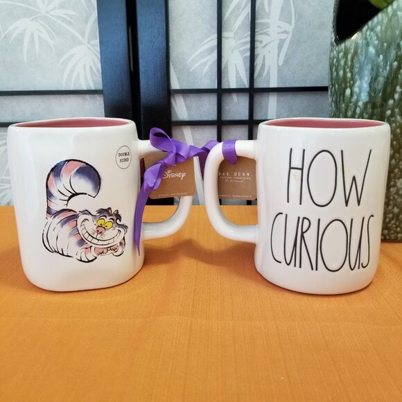 Set of 2 Rae Dunn Disney Cheshire Cat HOW CURIOUS Double Sided Mug - Pink NWT - Picture 1 of 4